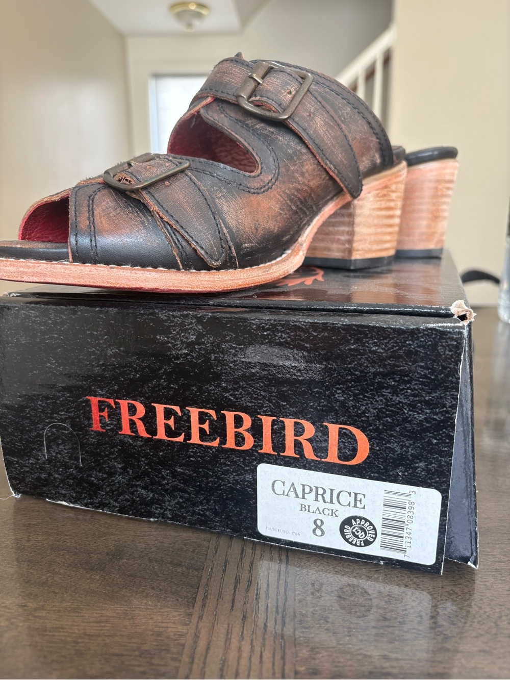 freebird distressed black leather slide mules with stacked tan heel